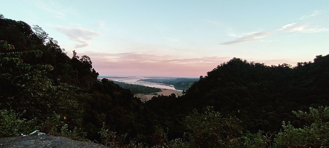 Dusk over forested hills and a river in Dibang Valley