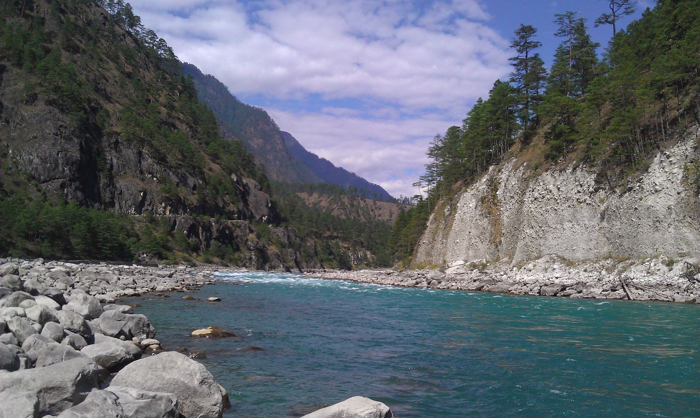 The blue-green Lohit river between steep forested cliffs